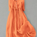 Orange button-front tie-waist dress with 3/4 sleeves and gathered skirt.