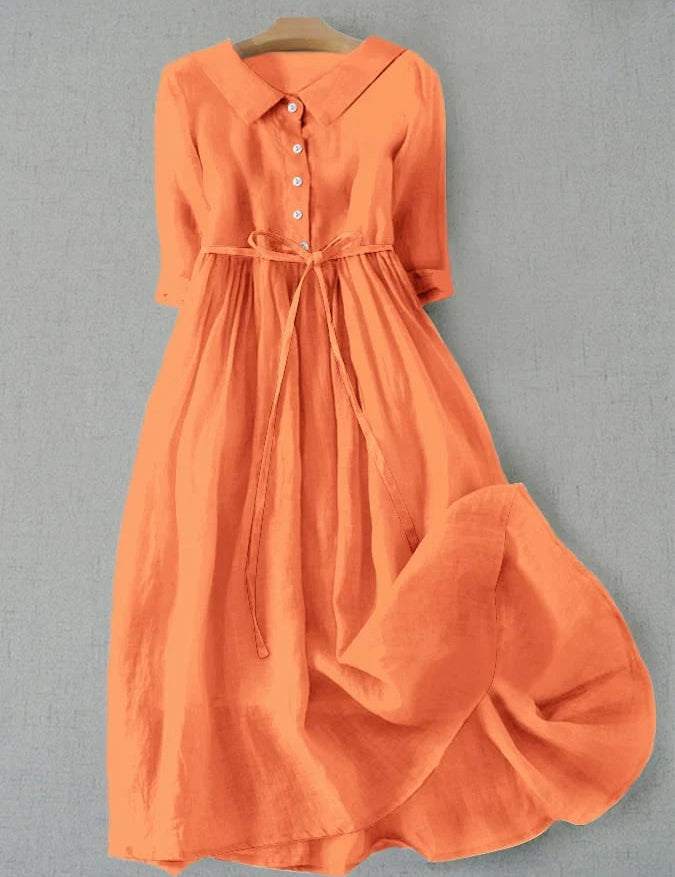 Orange button-front tie-waist dress with 3/4 sleeves and gathered skirt.
