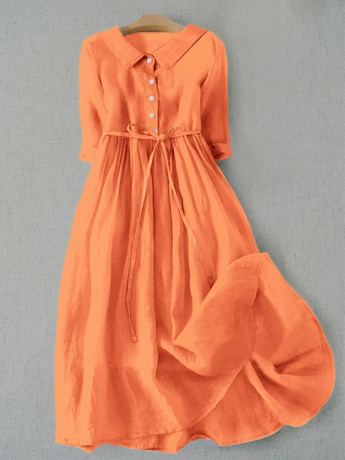 Orange button-front tie-waist dress with 3/4 sleeves and gathered skirt.