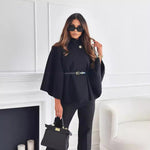 Black belt jacket with button collar, wide cape sleeves, and gold-buckle waist belt