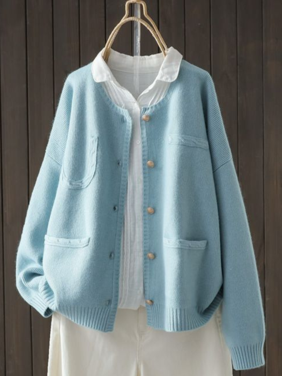 Light blue button-front cardigan sweater with stand collar, front pockets, ribbed cuffs