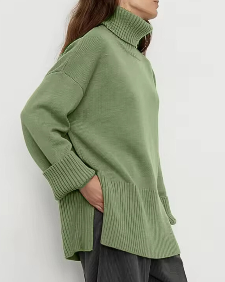Green knit turtleneck sweater with long sleeves, ribbed collar, and cuffs