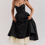 Women's black fitted bodice slimming dress with flared skirt and tulle hem