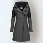 Women’s winter parka coat in dark gray with black quilted sleeves, zip front, hood.