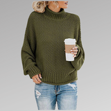 Olive green chunky knit sweater with ribbed turtleneck, long sleeves, and straight hem