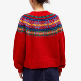 Back view pullover sweater in red knit with multicolor Fair Isle yoke and ribbed cuffs