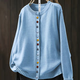 Light blue cardigan sweater with multicolor button front and ribbed crew neckline