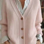 Pink knit V-neck cardigan with button front and ribbed cuffs, long sleeves