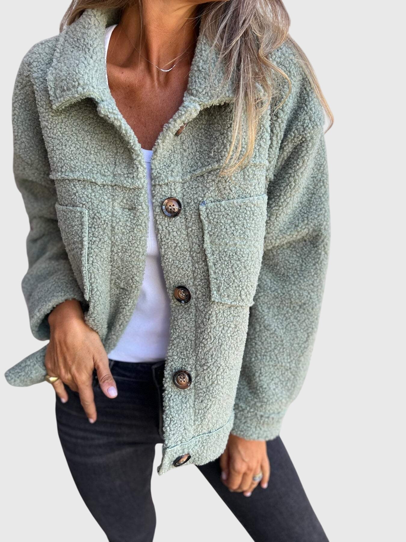 Green sherpa jacket with button front and flap pockets