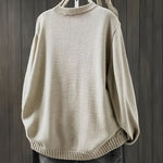 Beige cardigan sweater, long sleeves with ribbed collar, cuffs, and hem