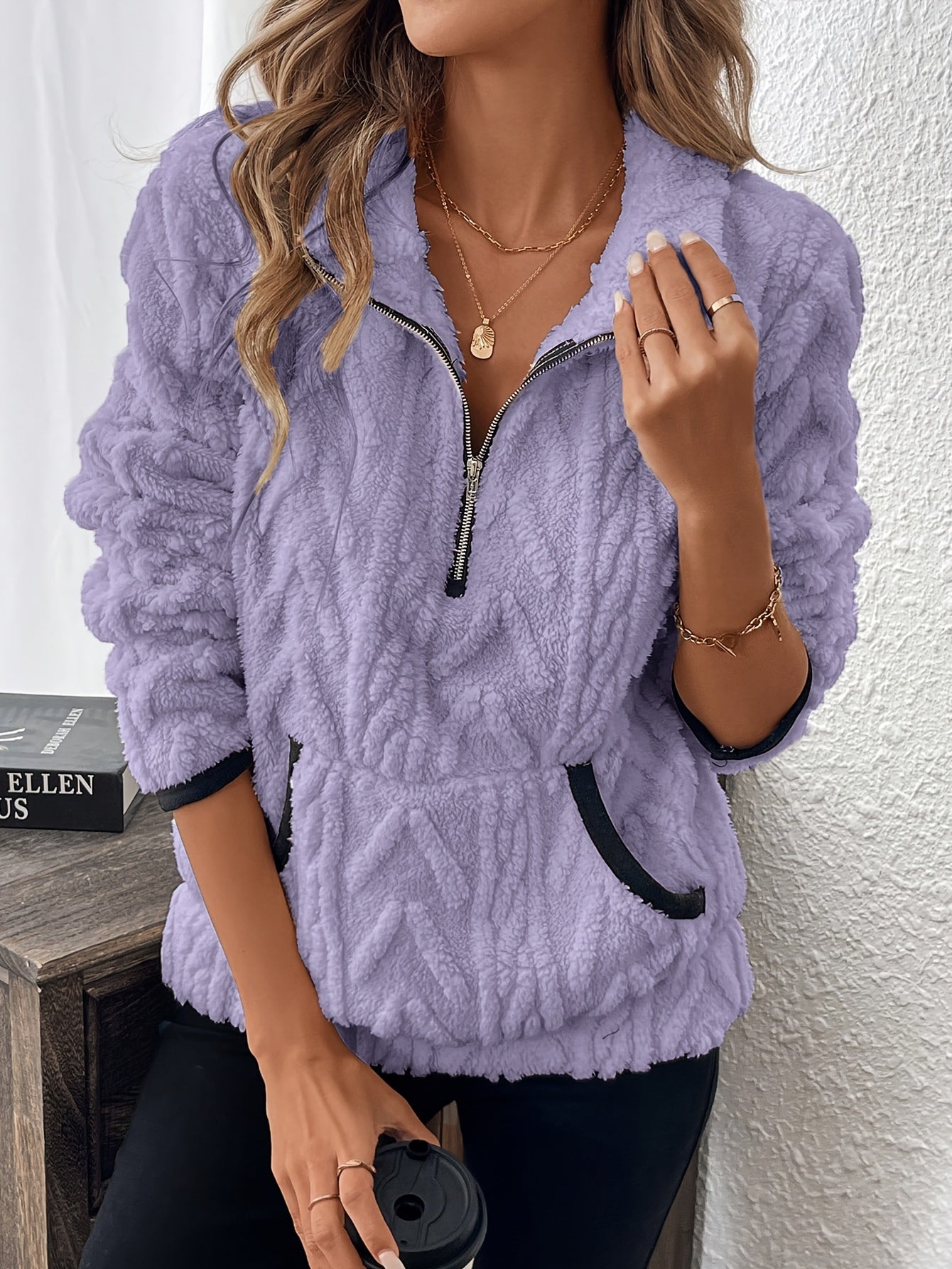 Lavender fuzzy quarter-zip pullover with short sleeves and navy-trim accents