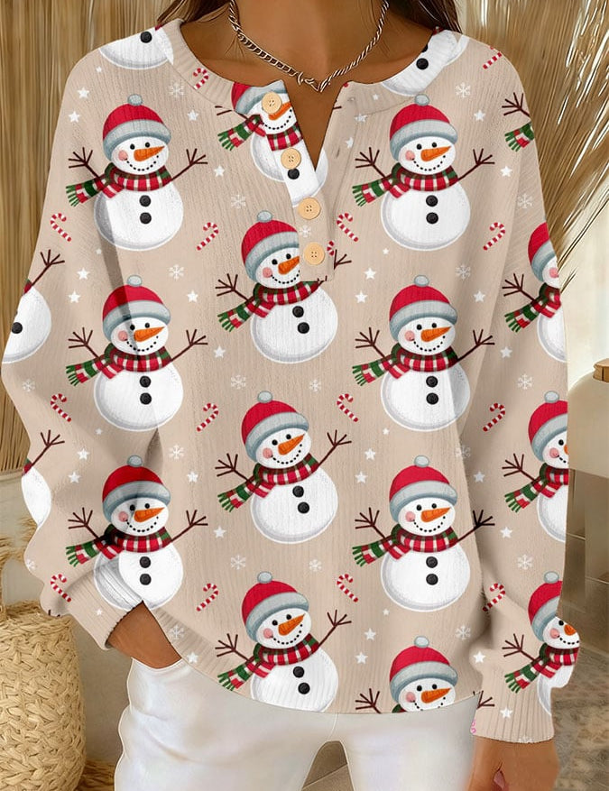 Cream long-sleeve button-front top with allover snowman print and crew neckline.