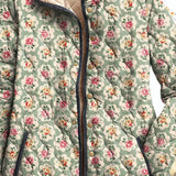 Floral hooded vintage jacket close-up with button placket and beige hood lining