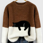 Brown and white two-tone sweatshirt with black cat graphic on the front