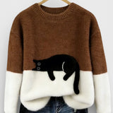 Brown and white two-tone sweatshirt with black cat graphic on the front