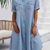 Light blue denim shirt dress with short sleeves, button front, and chest pockets
