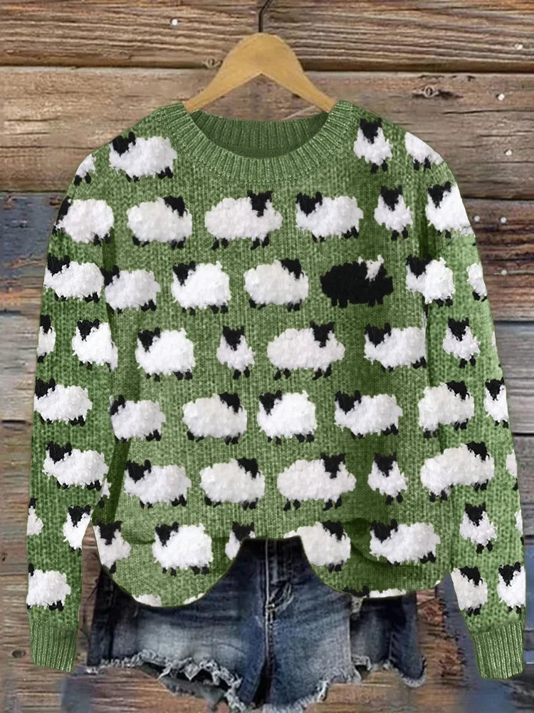 Festive knit sweater with green base and white cloud cow print, crew neck, long sleeves