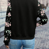 Black zip-up jacket with floral print sleeves, back view
