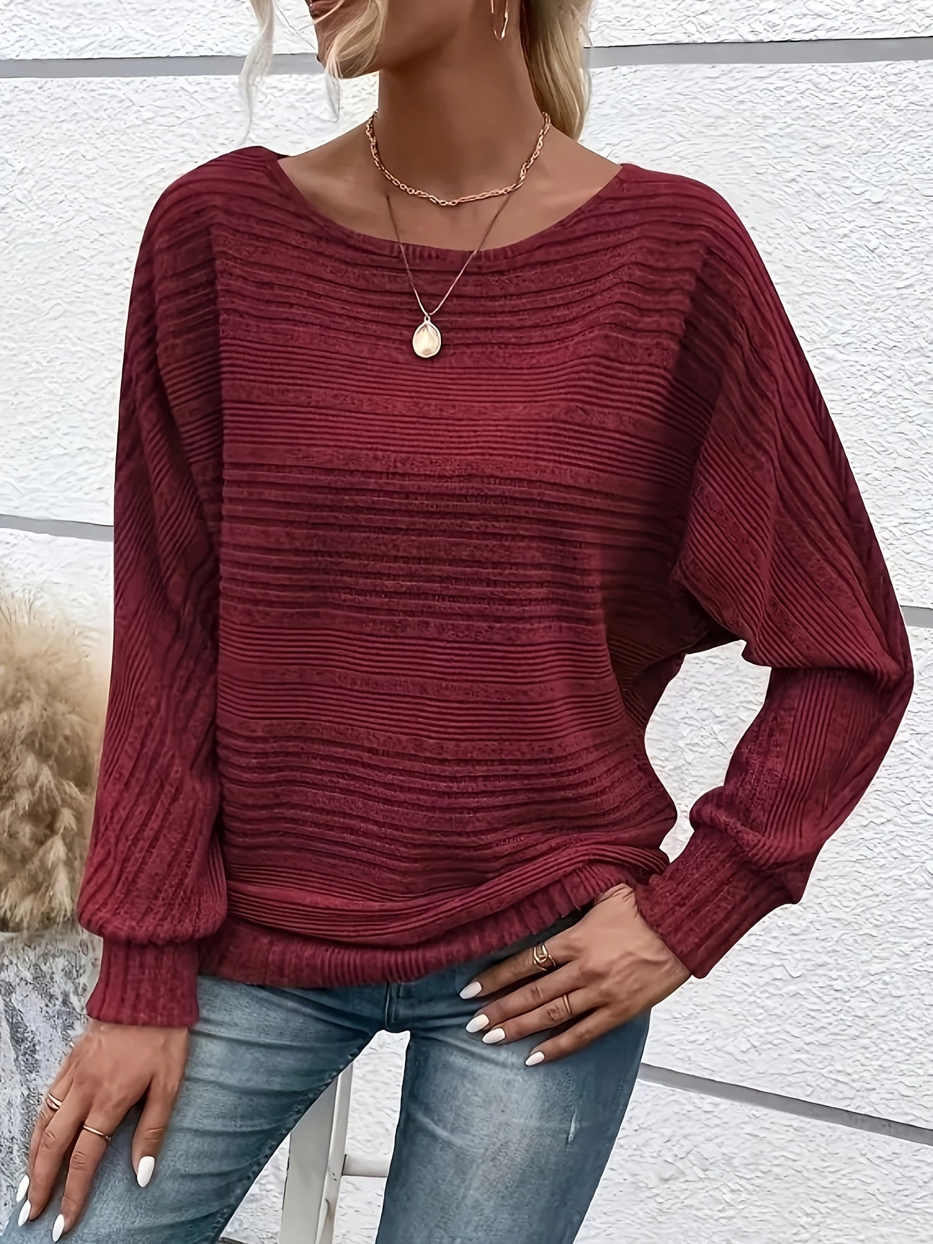 Burgundy striped knit pullover with batwing sleeves and ribbed cuffs, relaxed fit