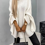 White knit pullover with textured stitch, loose batwing sleeves and crew neckline