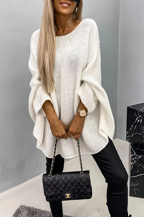 White knit pullover with textured stitch, loose batwing sleeves and crew neckline