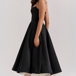 Women's black corset slimming dress with flared skirt and tulle underskirt, side view