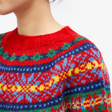 Red Fair Isle knit sweater collar and yoke detail with multicolor pattern
