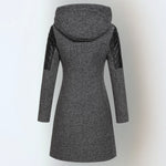 Women’s winter parka coat in dark gray, back view, quilted sleeves, attached hood.