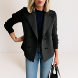 Black everyday blazer with notch lapels, four-button front, and ribbed long sleeves