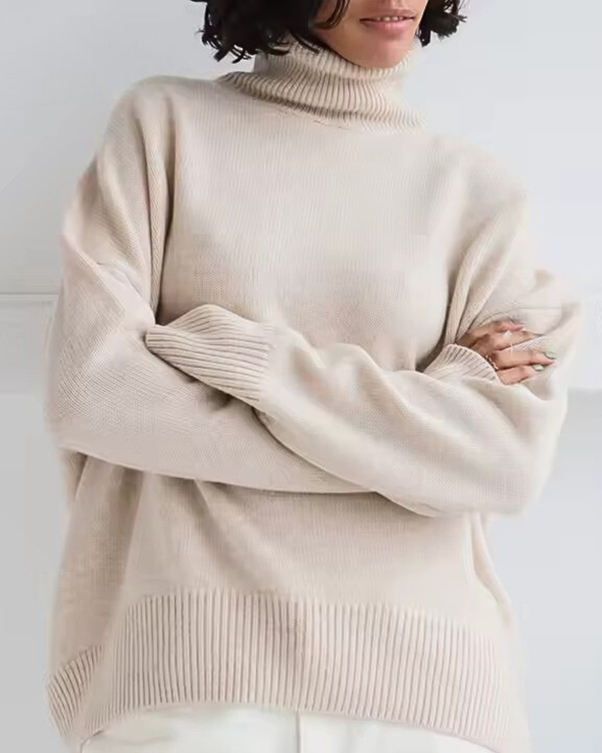 Oversized cream turtleneck knit sweater with ribbed hem and long sleeves