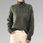 Women's cable-knit turtleneck sweater, olive green textured front and sleeves.