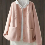 Light pink button-front cardigan sweater with stand collar, front pockets, ribbed cuffs