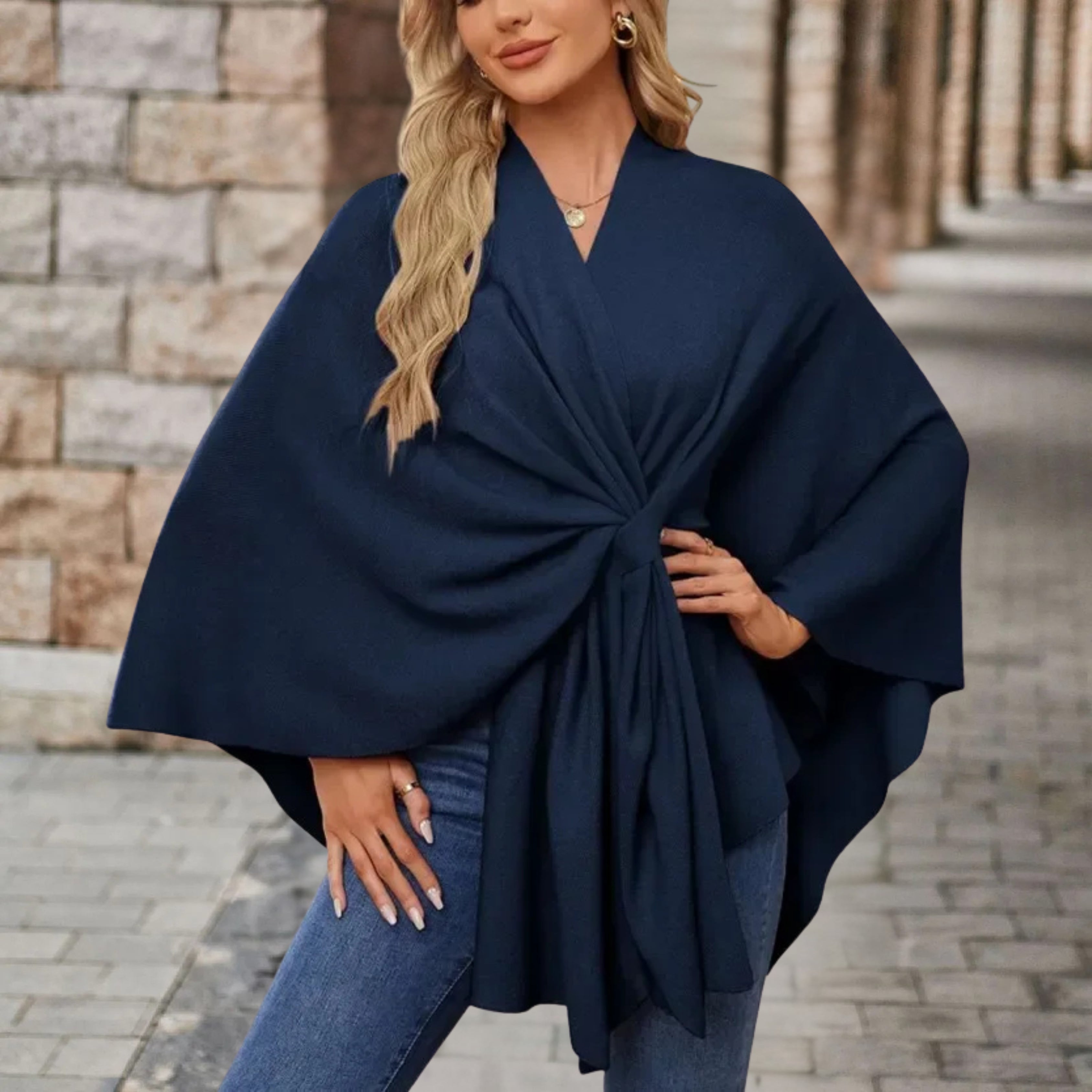 Navy draped poncho with V-neck and gathered front knot, wide cape sleeves