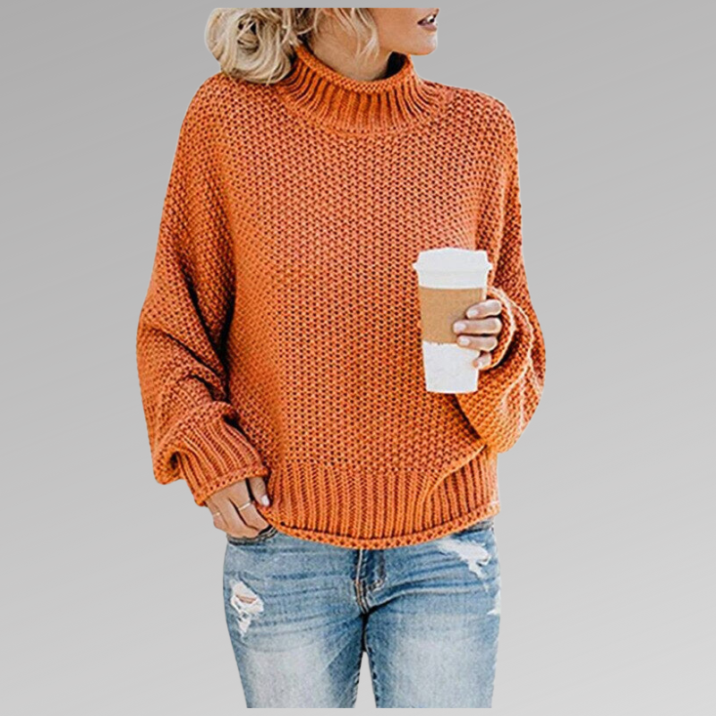 Orange chunky knit sweater with ribbed turtleneck, long sleeves, and straight hem