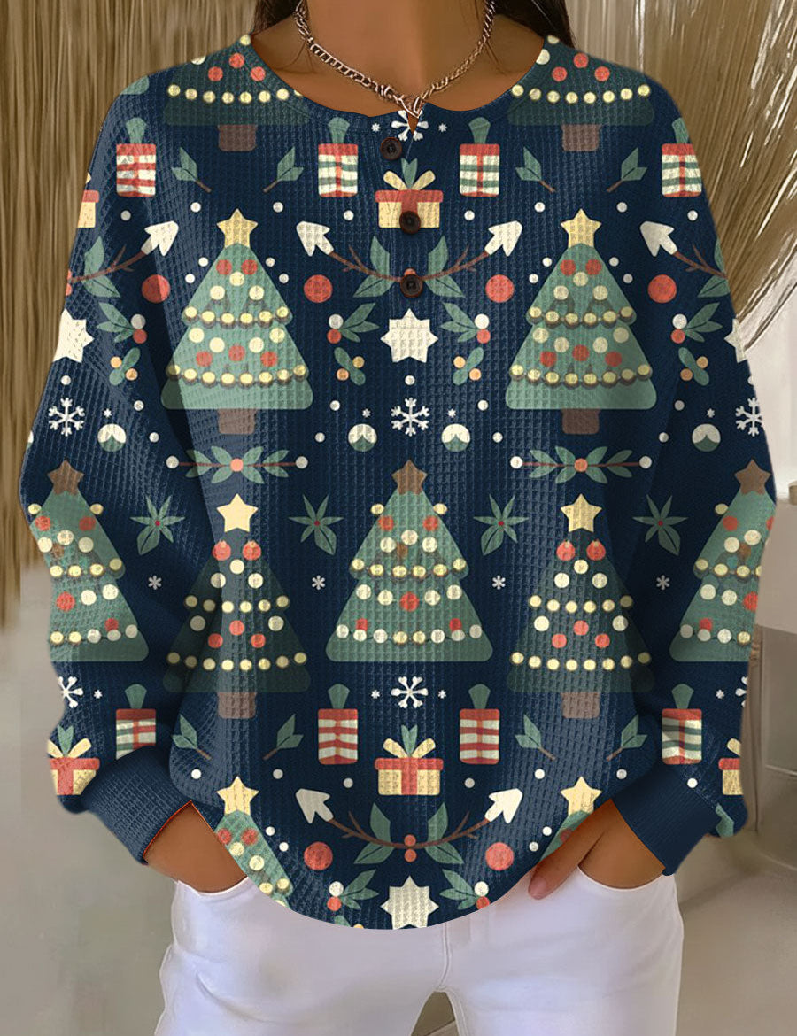 Women’s holiday crewneck top, blue with colorful trees, gifts, and front buttons