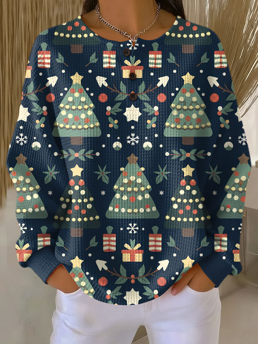Women’s holiday crewneck top, blue with colorful trees, gifts, and front buttons