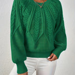 Emerald green cable-knit long-sleeve pullover with half-zip neckline and ribbed cuffs