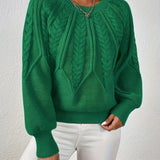 Emerald green cable-knit long-sleeve pullover with half-zip neckline and ribbed cuffs