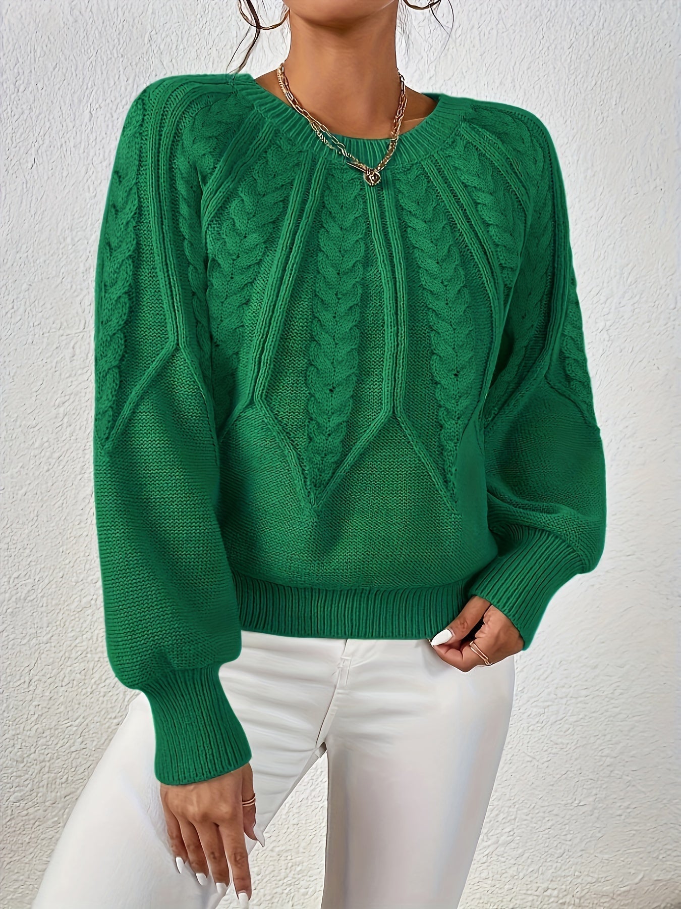 Emerald green cable-knit long-sleeve pullover with half-zip neckline and ribbed cuffs