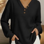 Women's black waffle-knit V-neck pullover with wood-look button placket