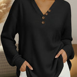 Women's black waffle-knit V-neck pullover with wood-look button placket
