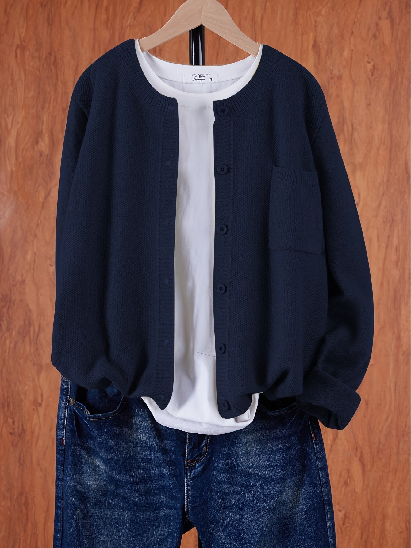 Navy blue round-neck cardigan with button front and side pocket