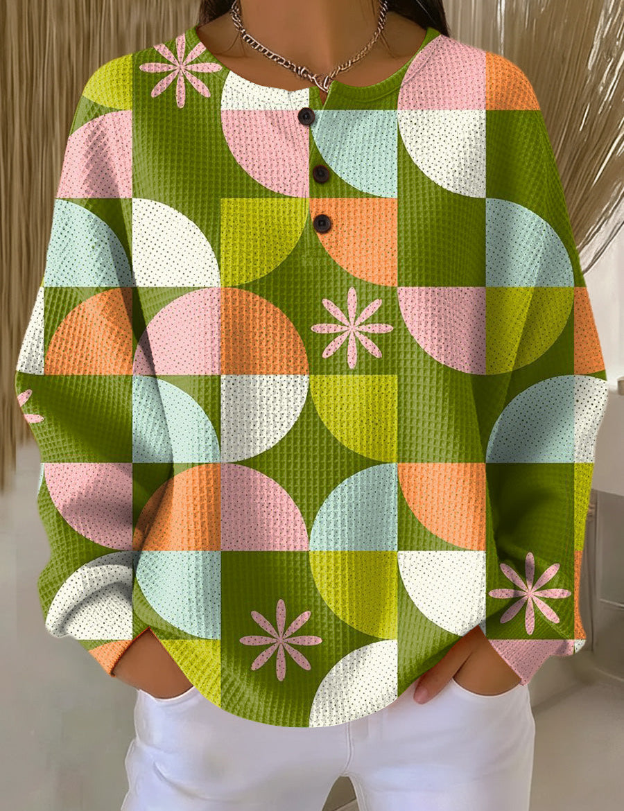 Abstract check-pattern sweater with long sleeves, multicolor green orange pink white, button front.
