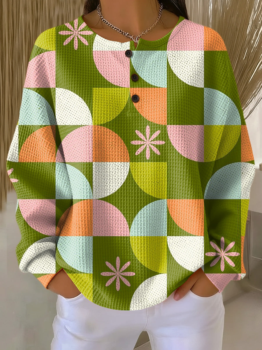 Abstract check-pattern sweater with long sleeves, multicolor green orange pink white, button front.