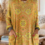 Vintage-inspired hooded knit tunic with front pockets, yellow orange multicolor ethnic print