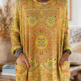 Vintage-inspired hooded knit tunic with front pockets, yellow orange multicolor ethnic print