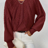 Burgundy cable-knit long-sleeve pullover with half-zip neckline and ribbed cuffs