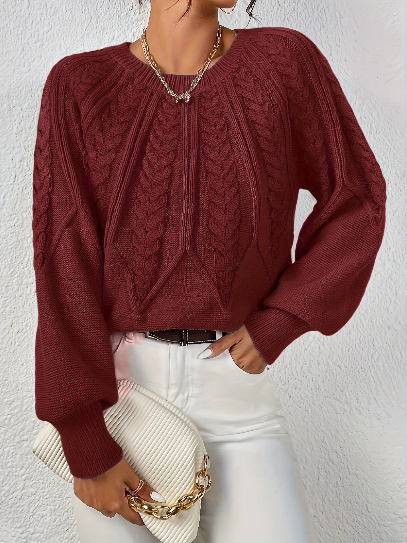 Burgundy cable-knit long-sleeve pullover with half-zip neckline and ribbed cuffs
