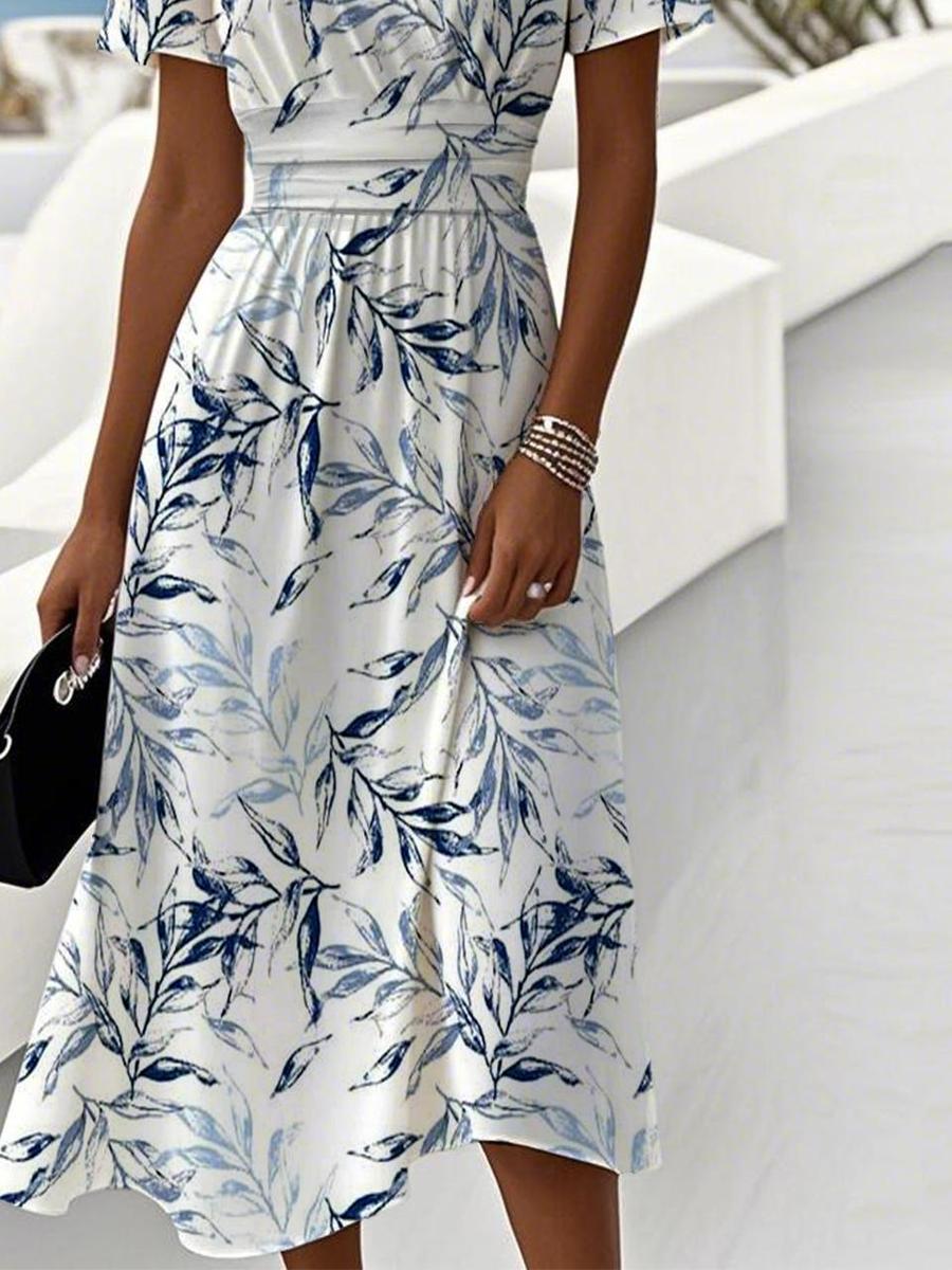 White midi dress with blue leaf print, gathered skirt and waist detail