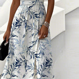 White midi dress with blue leaf print, gathered skirt and waist detail